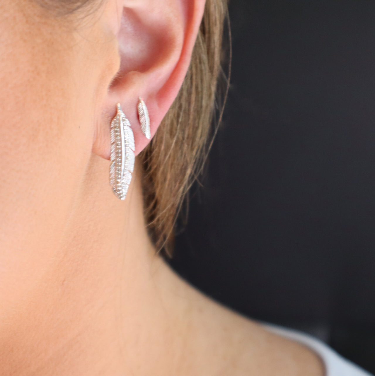 Model wearing the Soar with Joy™ Petite Sterling Silver Earrings and Sterling Silver with Diamonds Earrings.